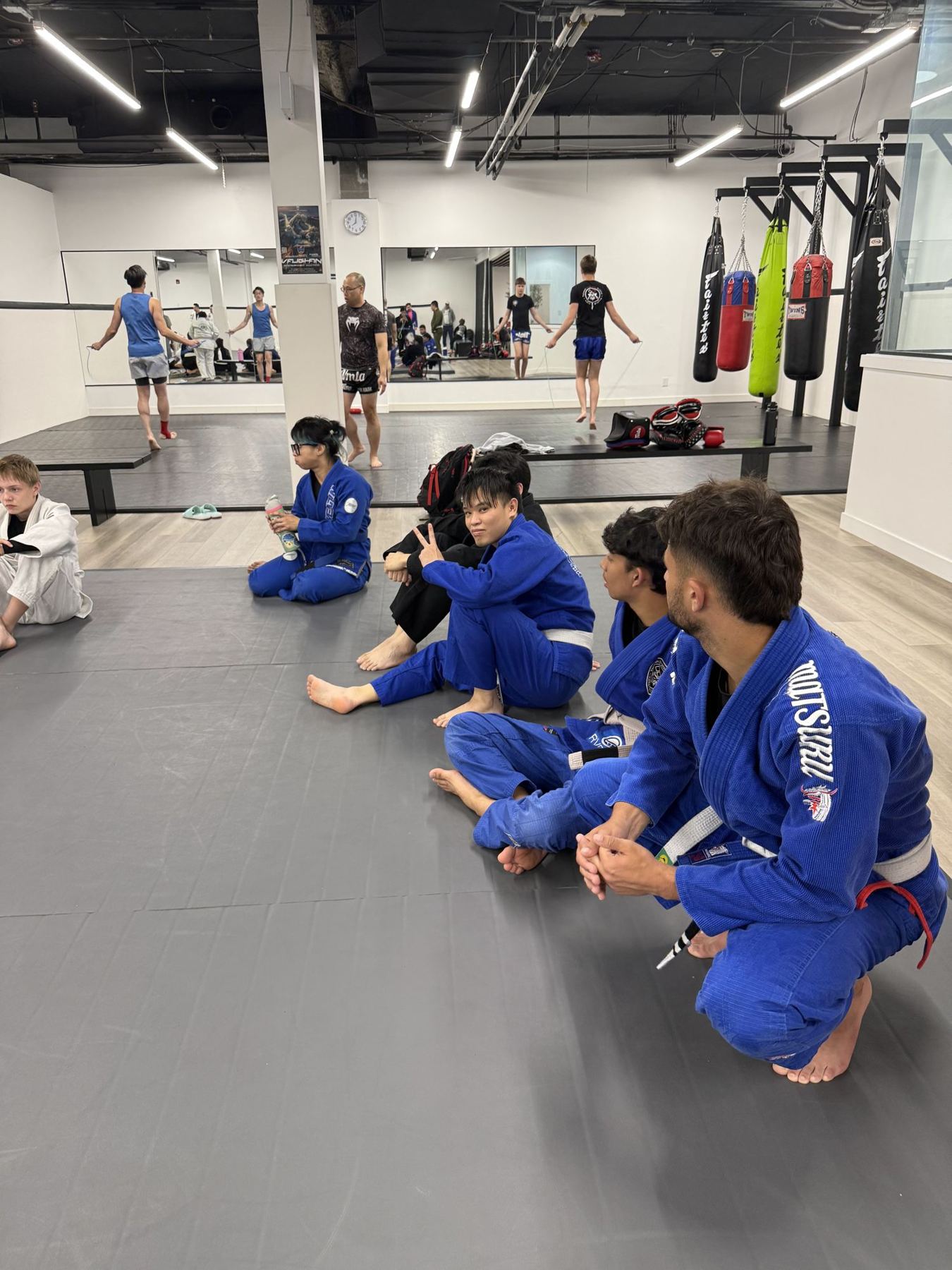 Students waiting on the mat at the summer grading